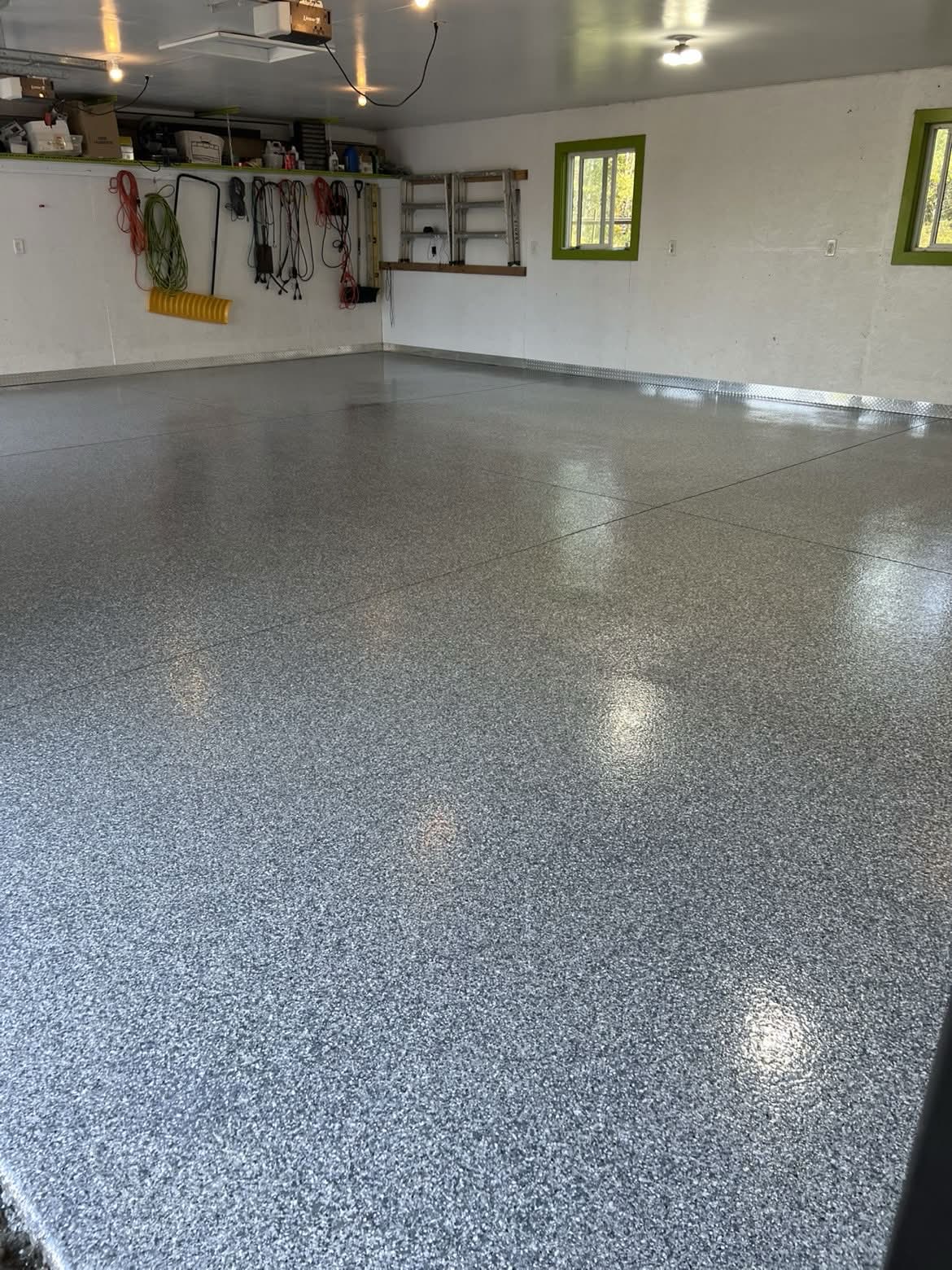 Detailed view of the finished grey flake garage floor