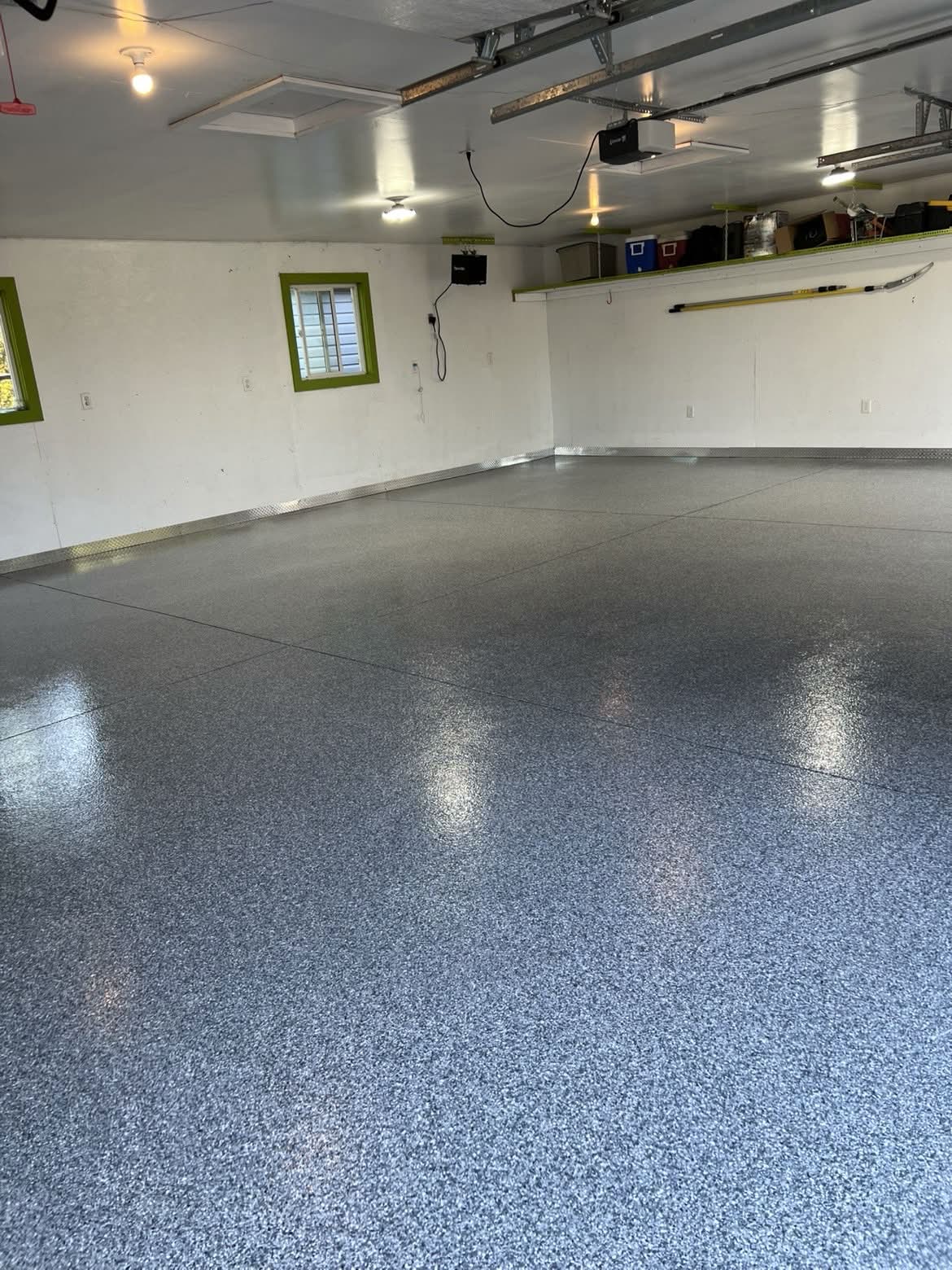 Finished grey flake garage floor with green window trim