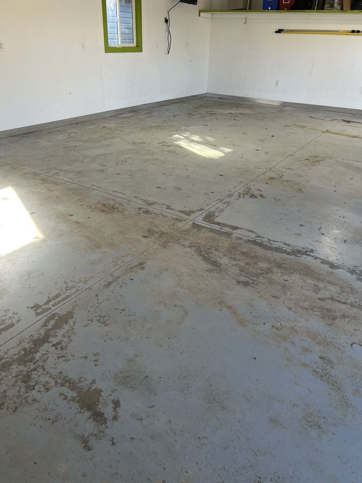 Original worn and stained concrete before coating